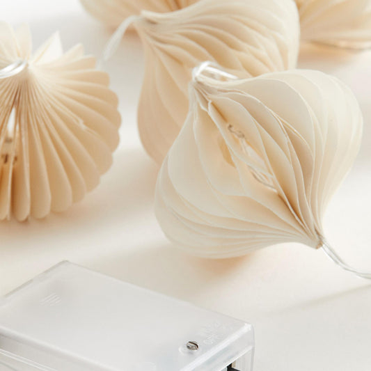 Cream Flower-Shaped Honeycomb Paper String Lights showing its structure