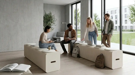 Students studying and socialising on foldable honeycomb paper benches in a modern student accommodation communal lounge