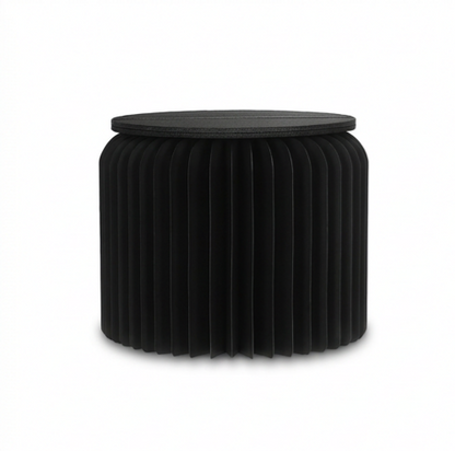 Black ribbed foldable paper stool on a white background