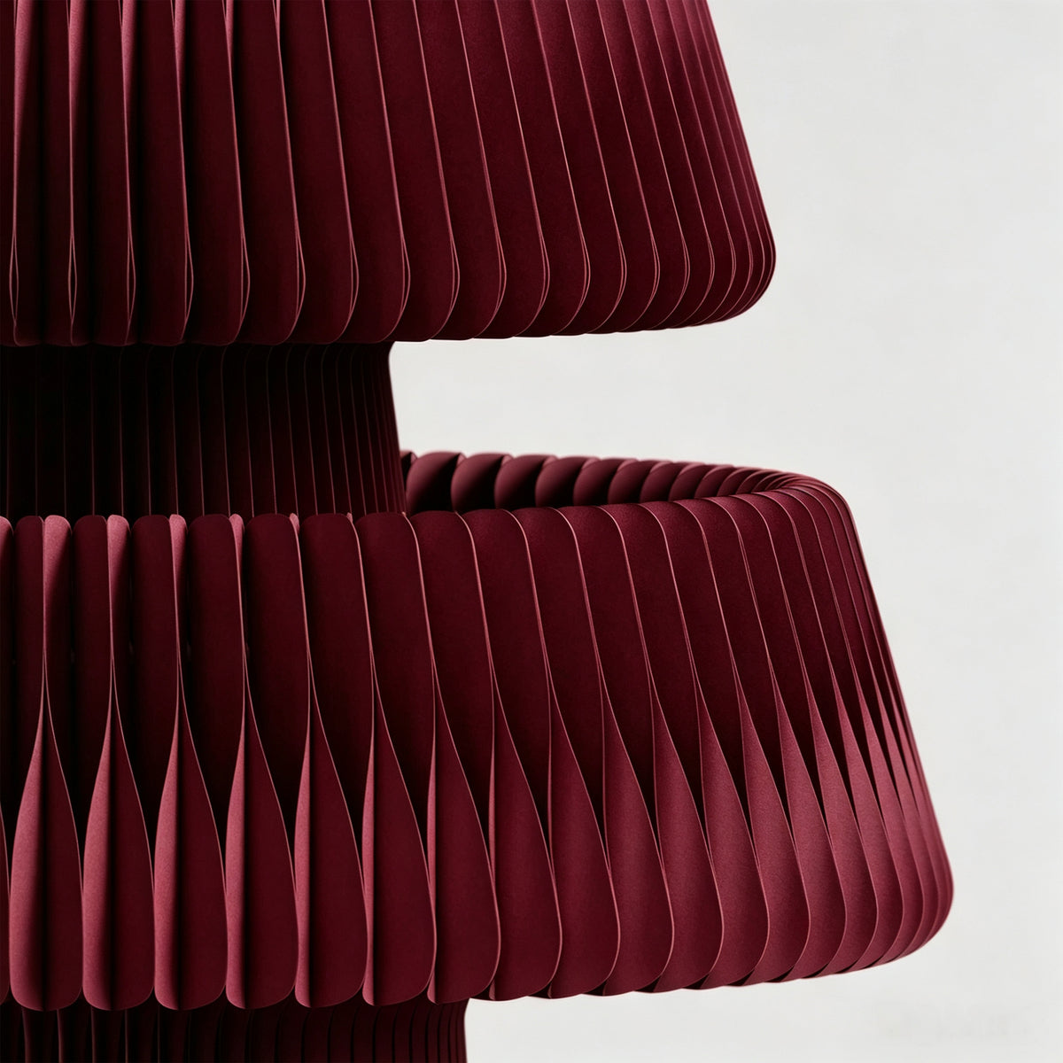 Honeycomb structure development – close-up of burgundy expandable paper honeycomb material