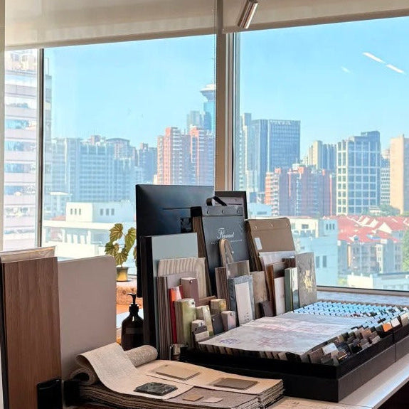 Custom design process – material samples and mood boards on designer desk