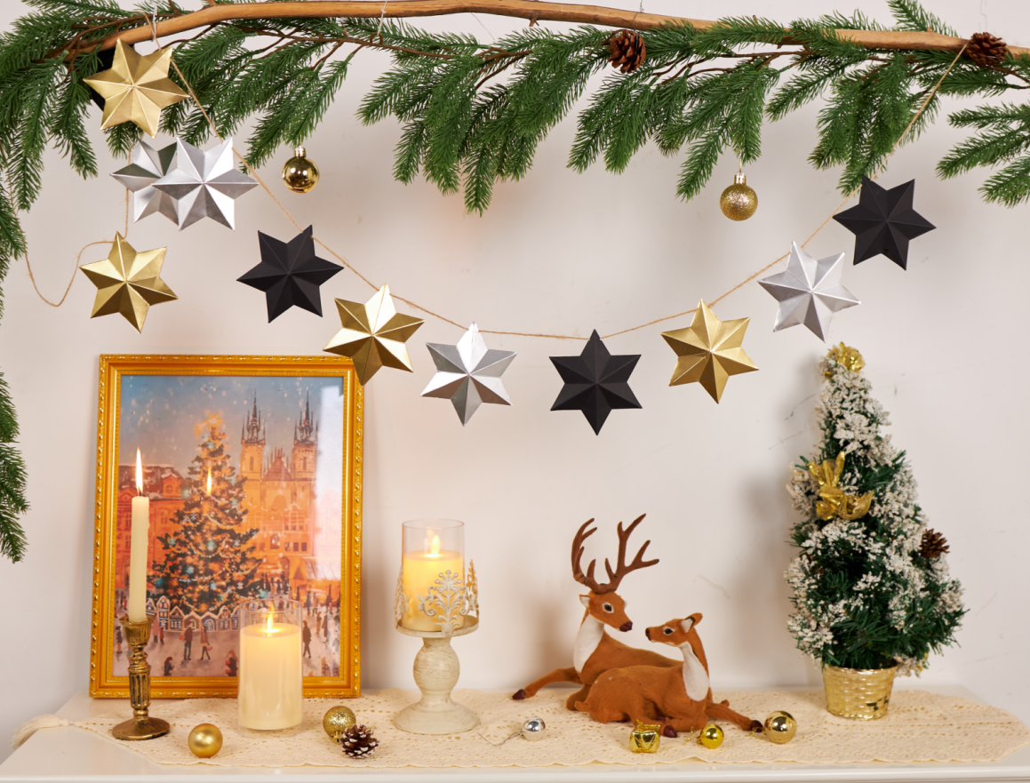 Private-label packaging – gold and black paper star ornaments on Christmas tree with packaging options