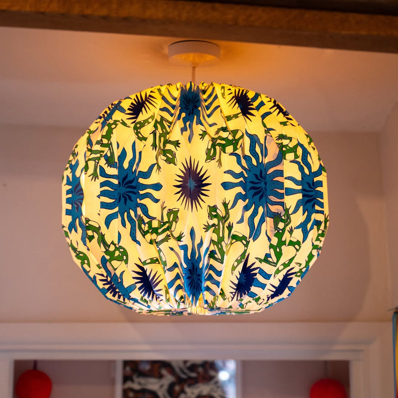 Large white origami paper lampshade in bright modern interior space