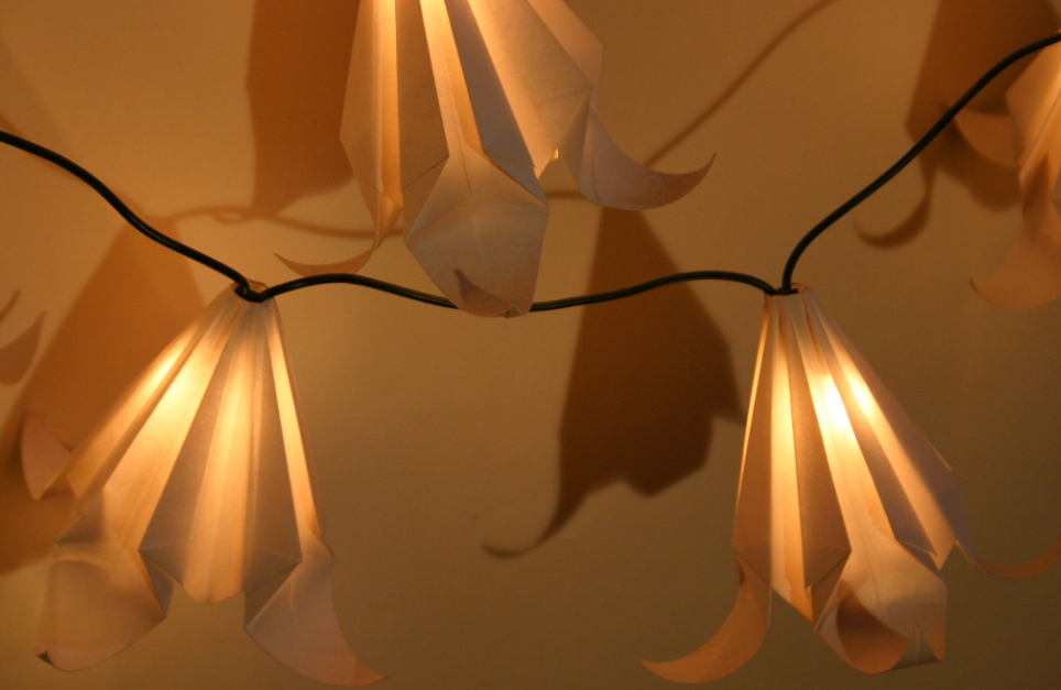 Warm origami paper lights with coordinated electrical components
