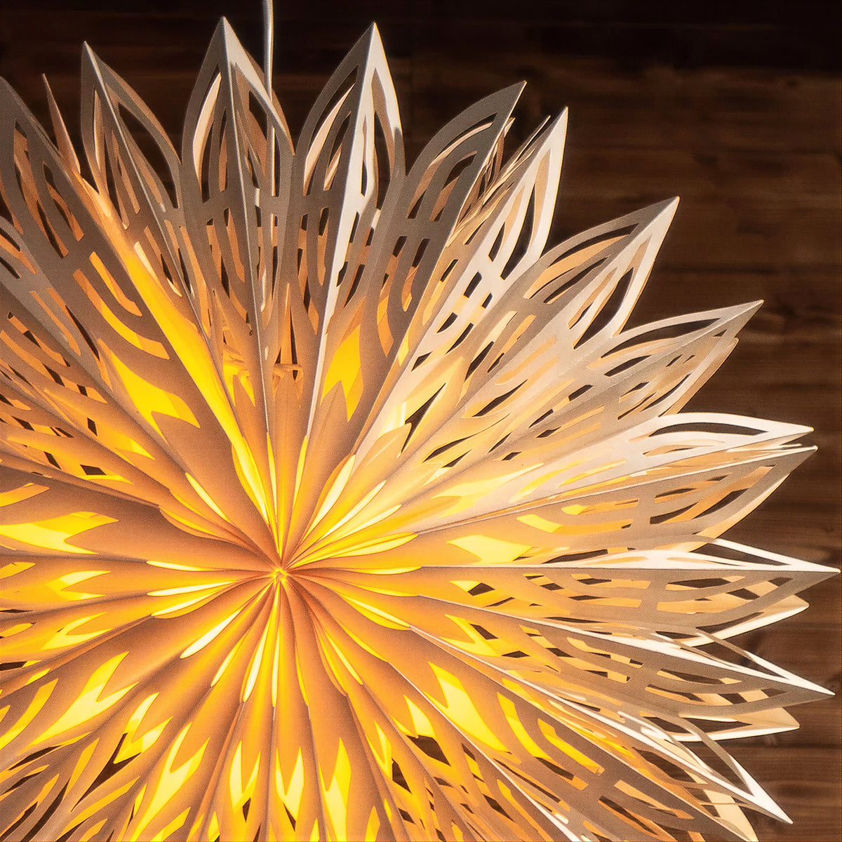 Illuminated multi-point paper star lampshade with warm light