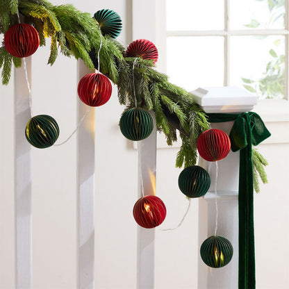 Folded Red and Green Honeycomb Paper String Lights for compact storage and shipping