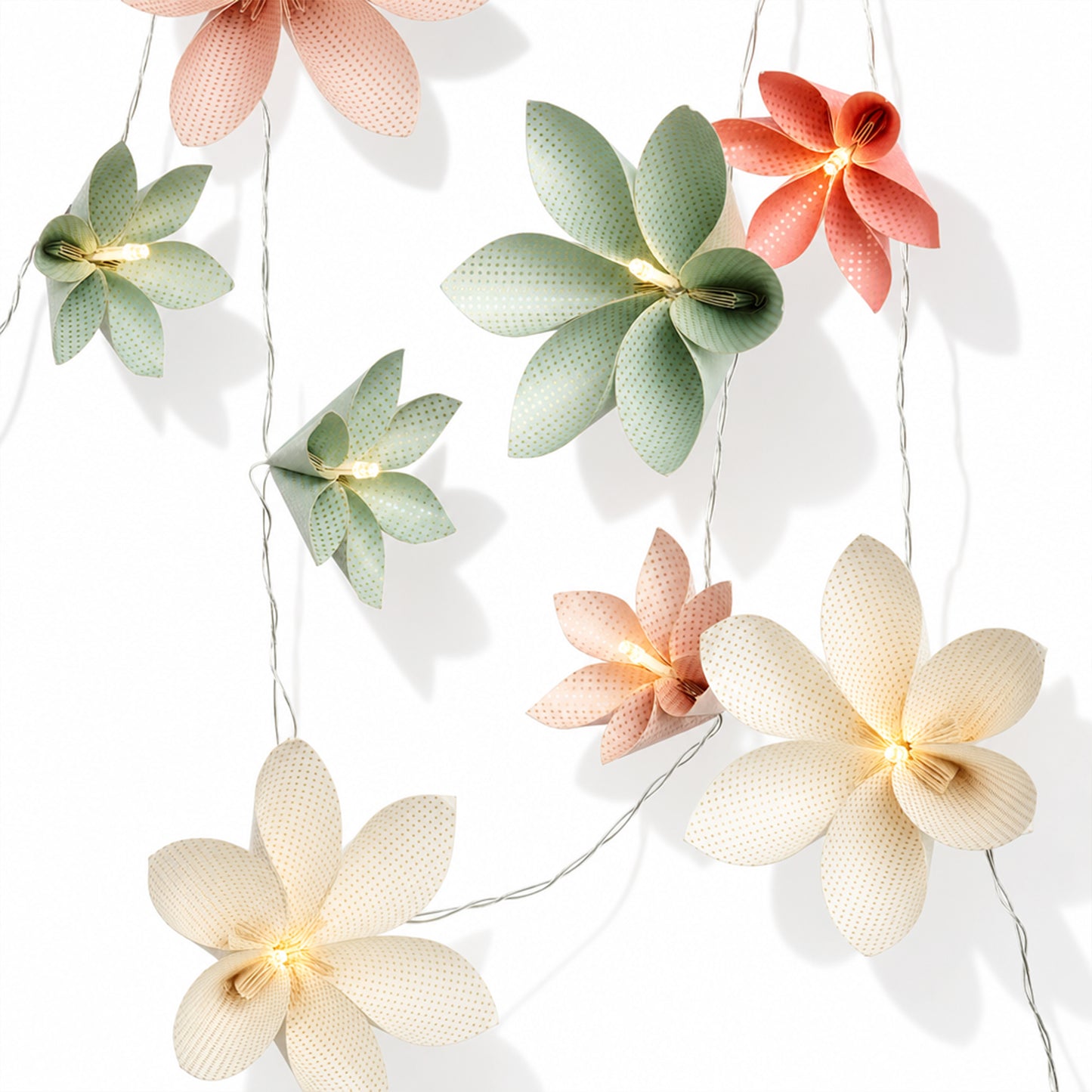 Multicolor Perforated Paper Flower String Lights on a white background