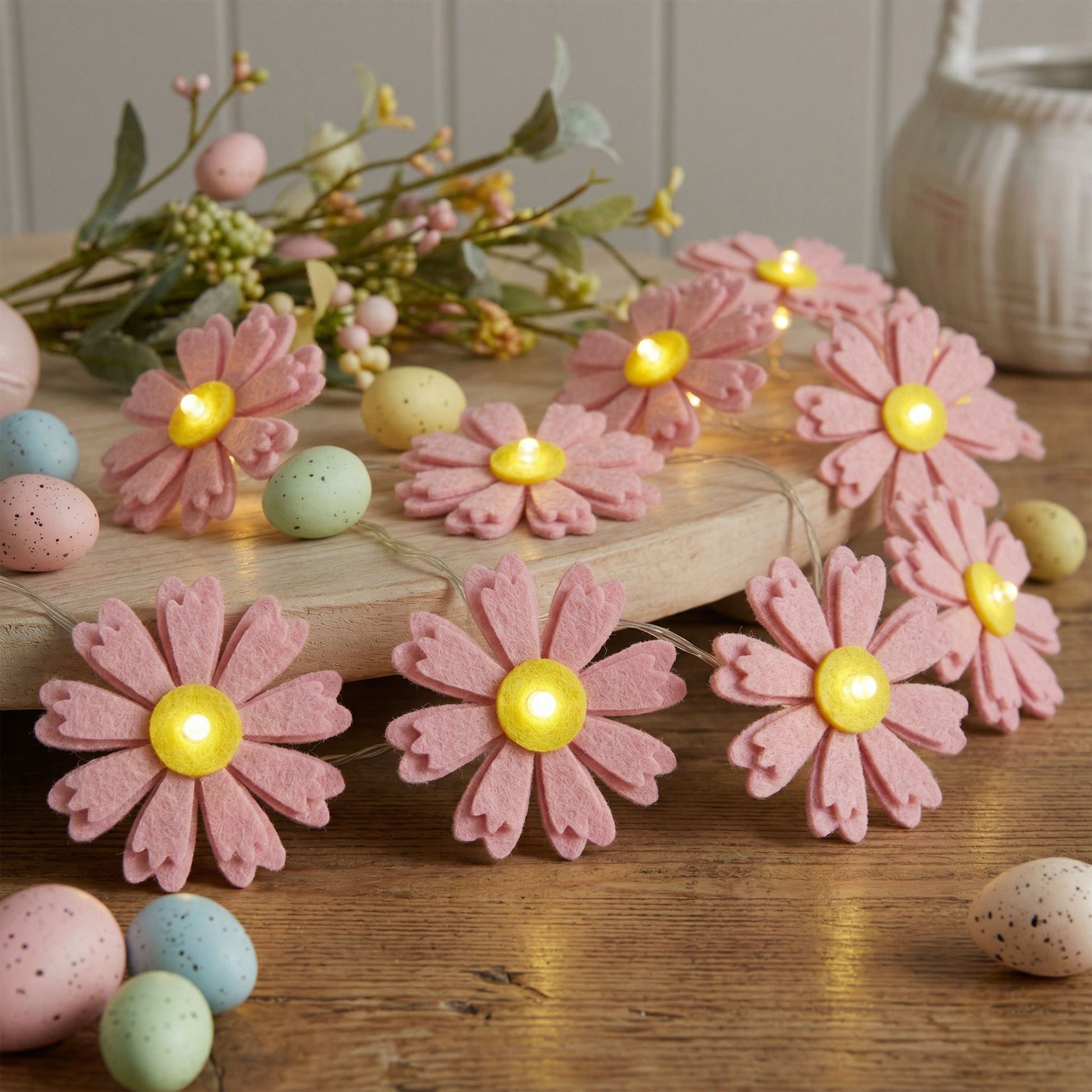 Folded Pink Felt Flower String Lights for compact storage and shipping
