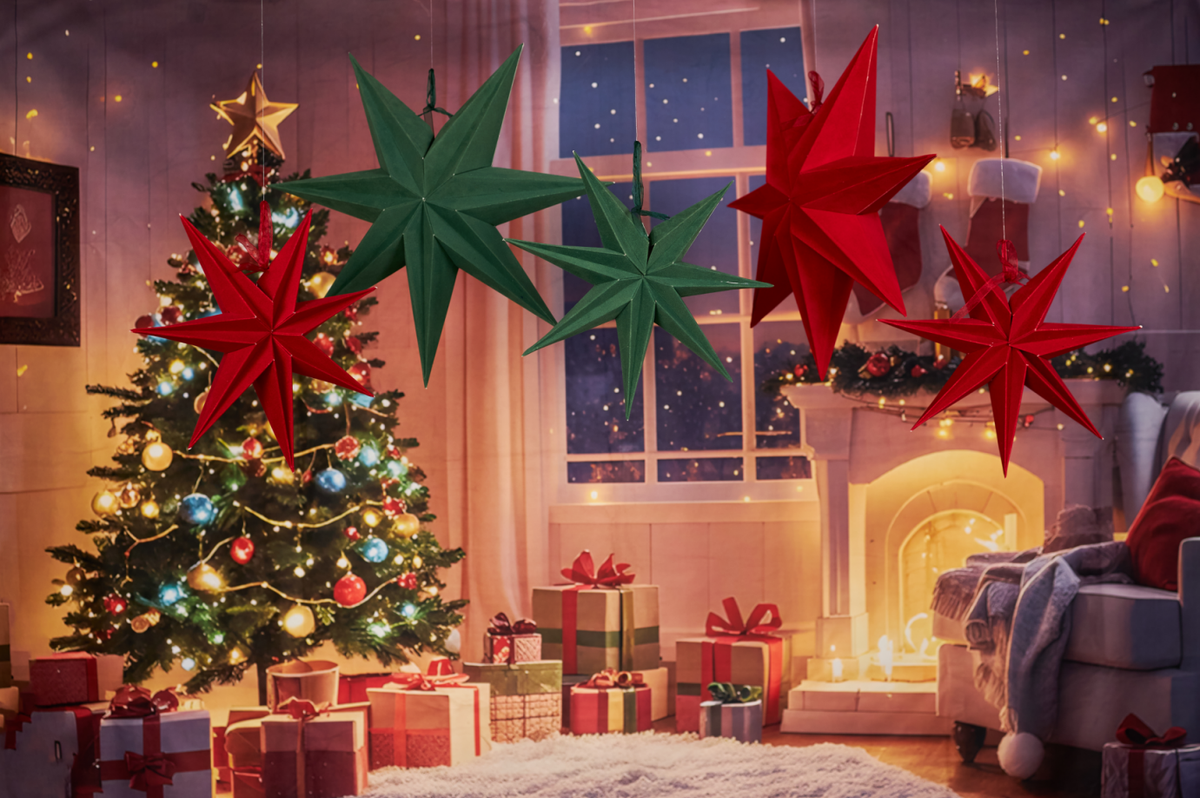 Project material review – red and green paper star decorations styled with Christmas tree display