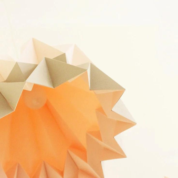 Folded White Origami Paper Pendant Lamp for compact storage and shipping