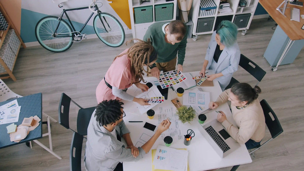 Brand and marketing team planning custom paper corporate gifts