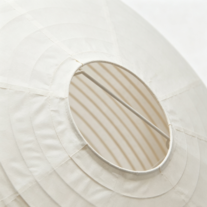 Large Round Rice Paper Pendant Lamp in a modern living room setting with natural light