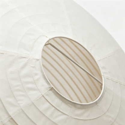 Large Round Rice Paper Pendant Lamp in a modern living room setting with natural light