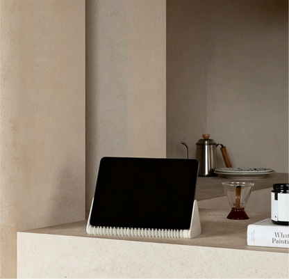 Honeycomb Paper Phone Stand in a modern living room setting with natural light