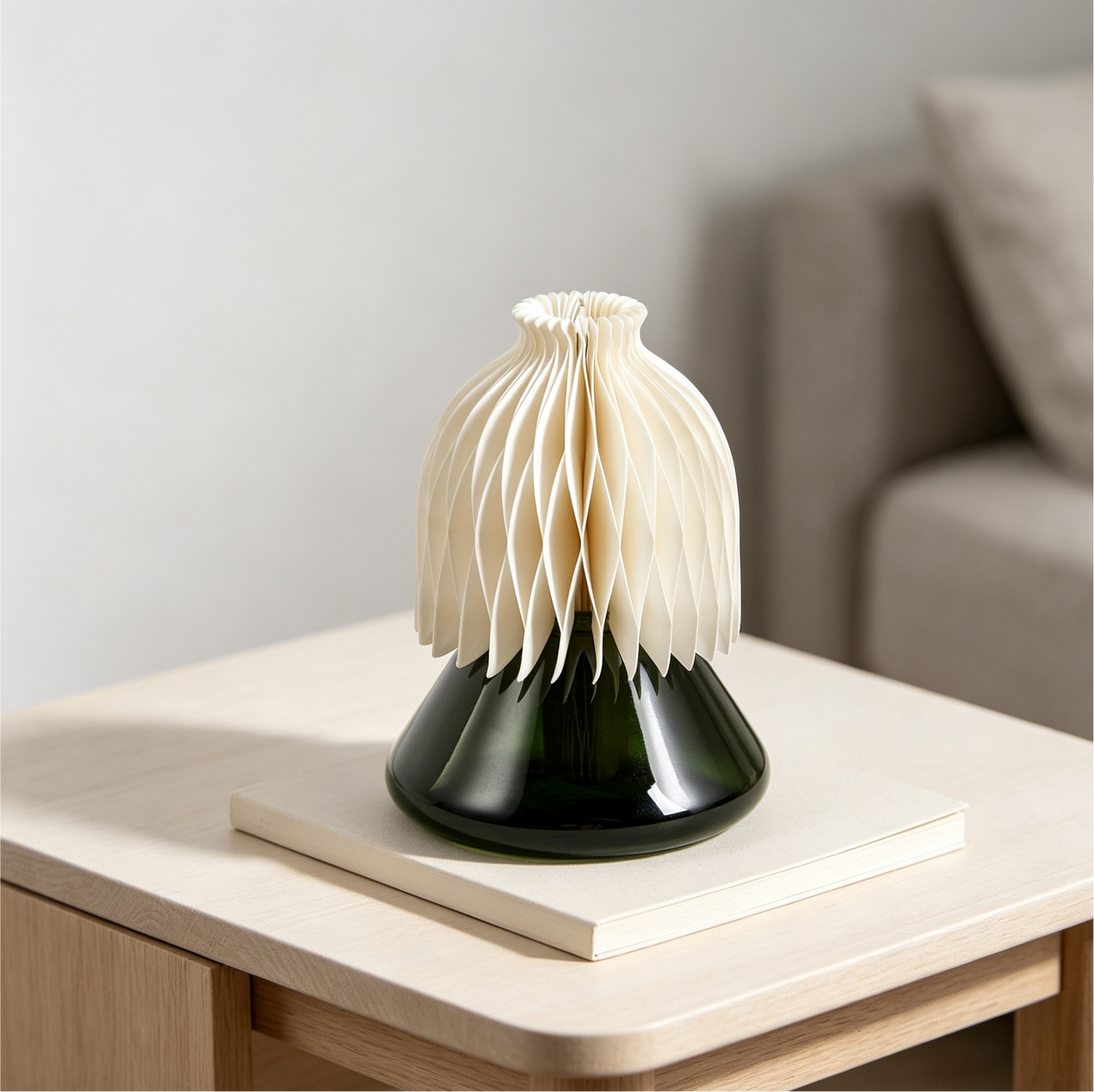 Honeycomb Paper Aroma Diffuser with Green Glass Bottle in a modern living room