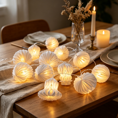 Folded Mixed-Shape White Honeycomb Paper String Lights for compact storage and shipping
