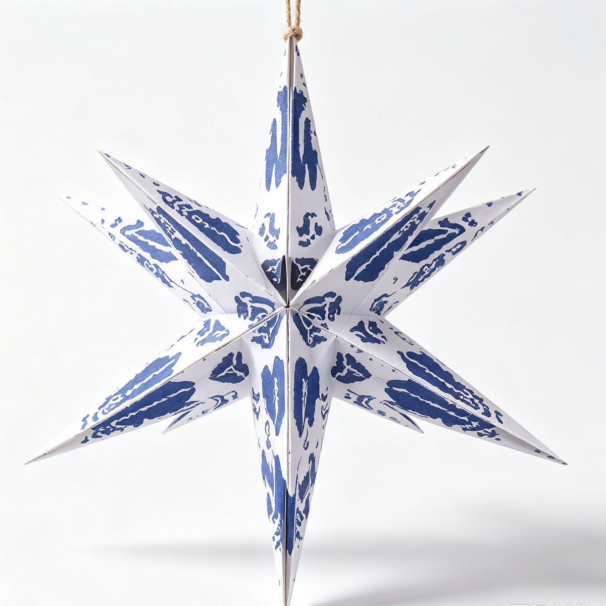 Multi-Point Paper Christmas Star Ornament on a white background