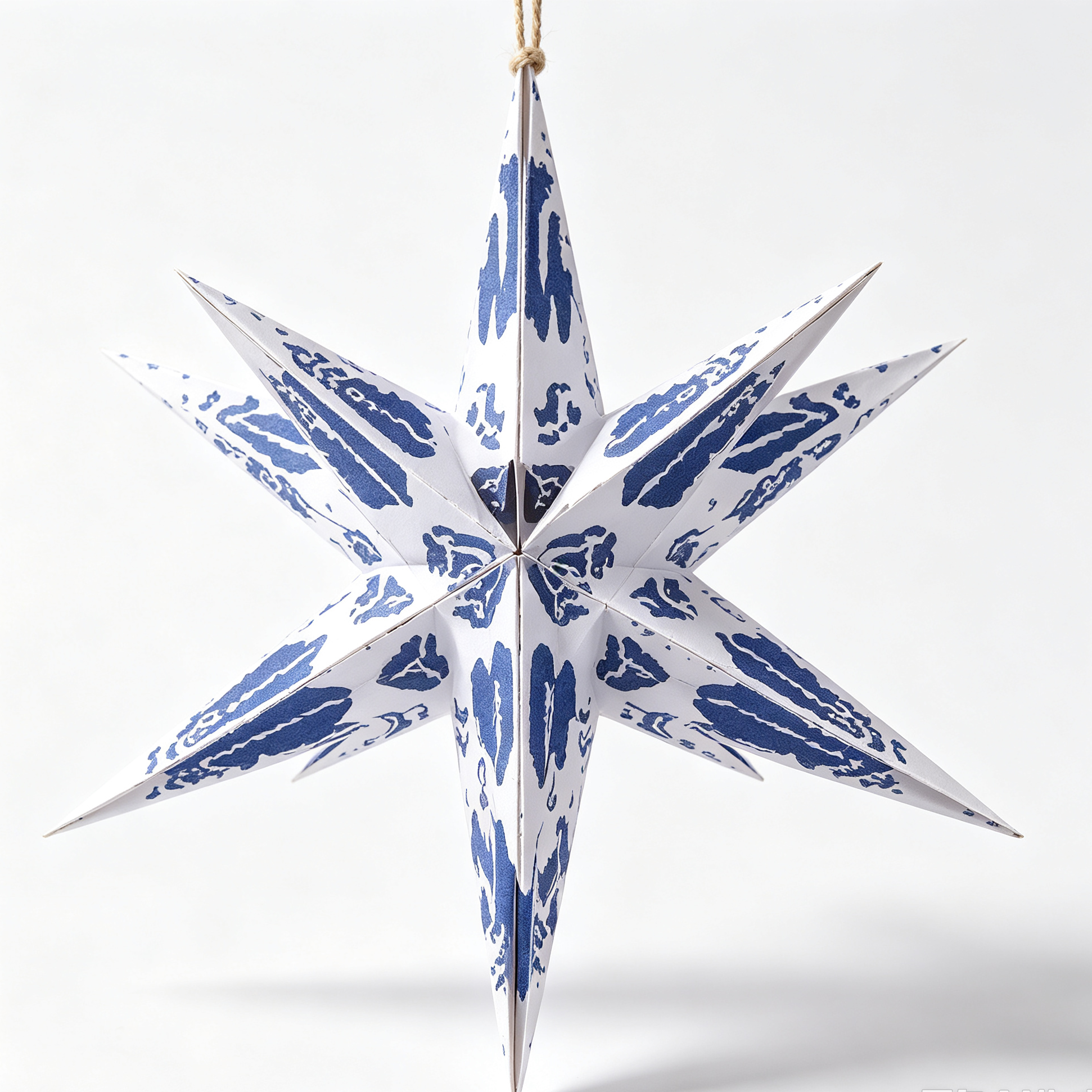 Multi-Point Paper Christmas Star Ornament on a white background