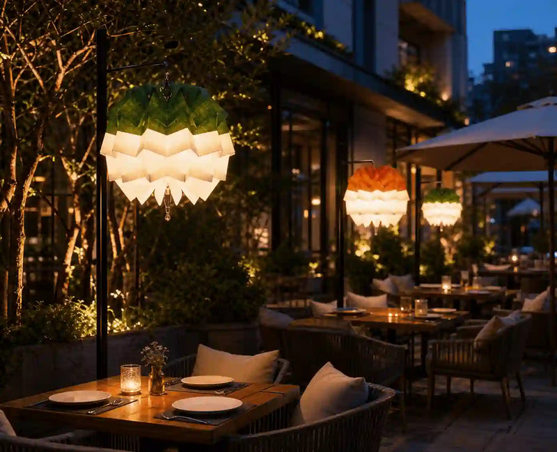 illuminated_origami_paper_lampshades_on_an_outdoor_restaurant_terrace