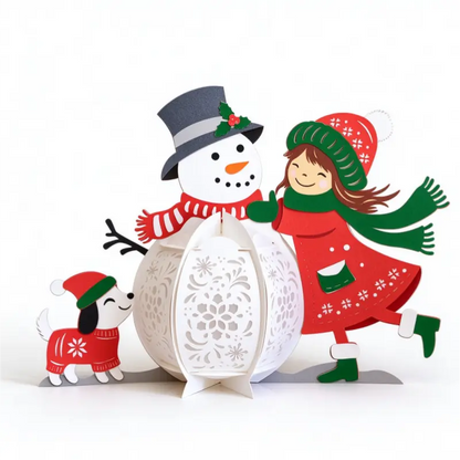 Illuminated Christmas snowman paper lantern decoration with winter girl and festive dog