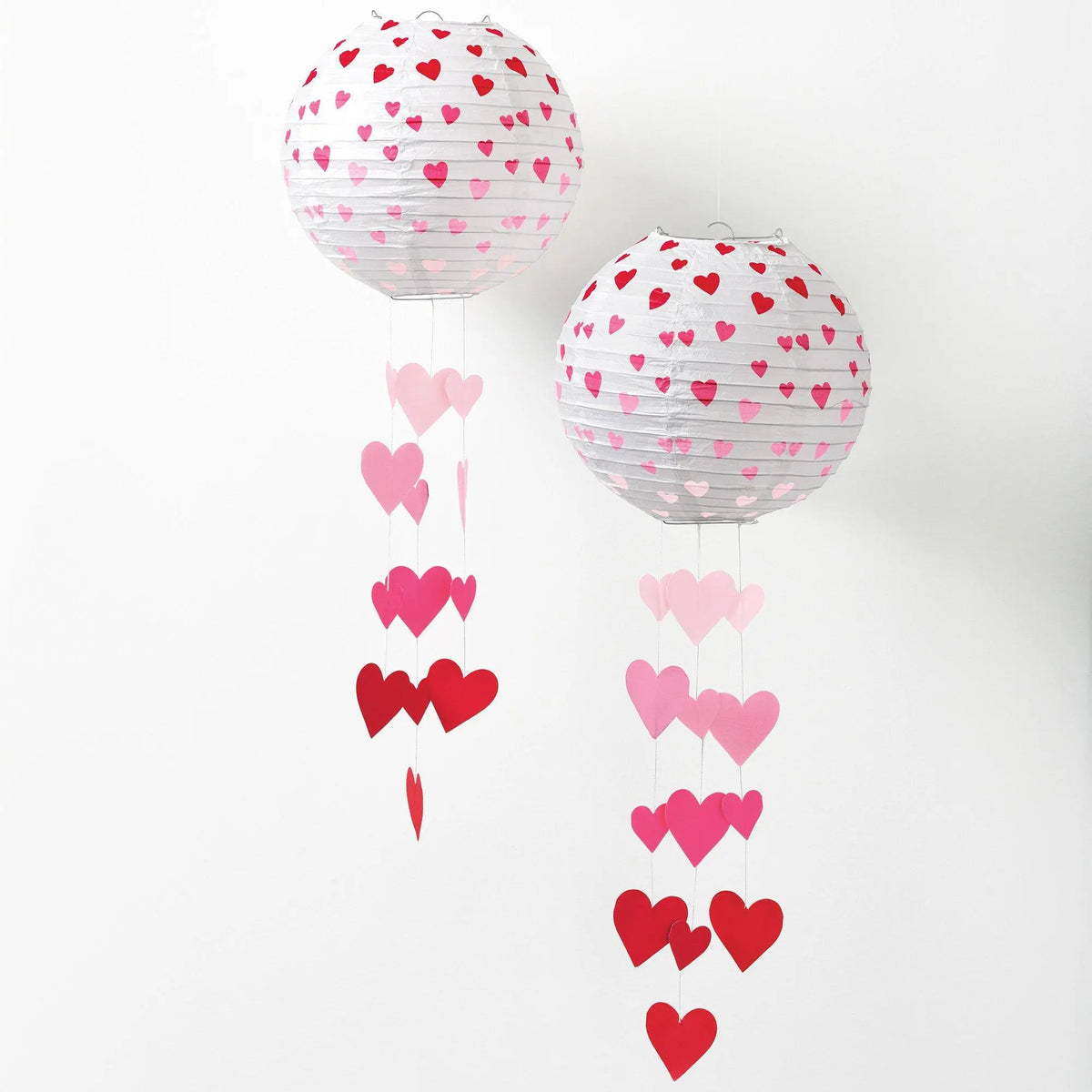 Valentine heart paper lantern mobiles shown unlit and illuminated with LED string lights