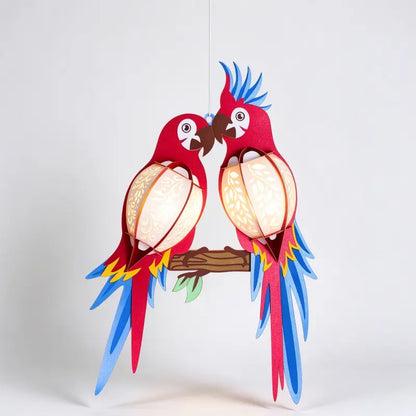 Colorful paired parrot paper hanging lantern with layered feathers and botanical cutout details