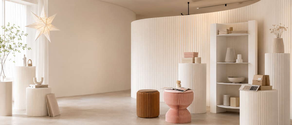 One-stop paper furniture and display sourcing – coordinated paper shelves and furniture in bright interior