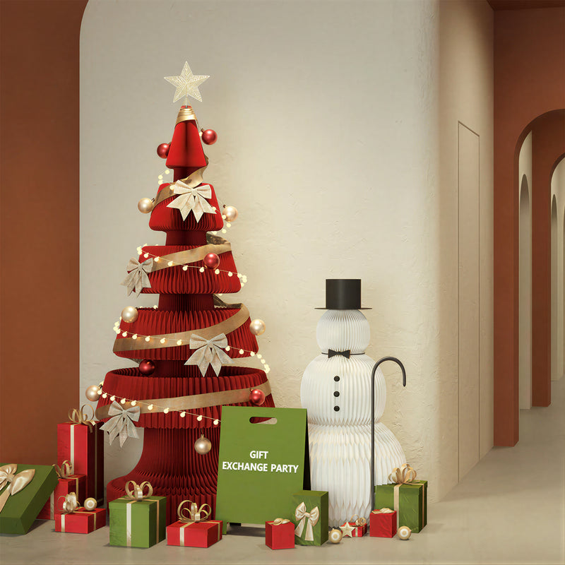 Red honeycomb paper Christmas tree display with gifts and a snowman