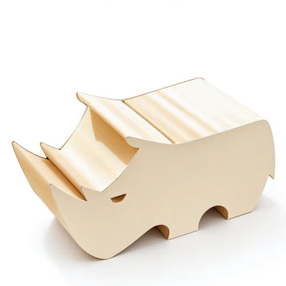 Rhino-shaped honeycomb paper kids stool in a children’s reading room with books