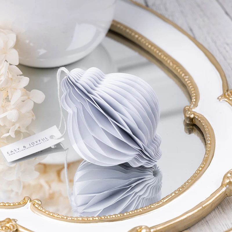 Folded White Honeycomb Paper Christmas Bauble Ornament for compact storage and shipping